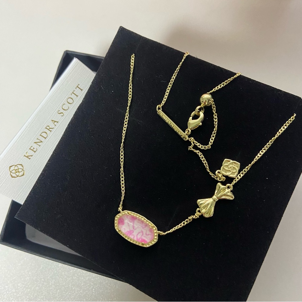 Kendra Scott Gold Necklace with Pink Marbled Pendant and Bow Charm - Picture 2 of 5